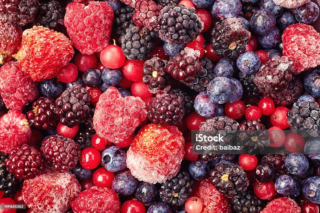 Frozen berries Close up of frozen mixed fruit - berries - red currant, raspberry, strawberry, blackberry, blueberry Frozen Stock Photo