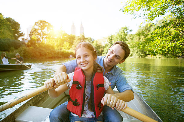 istock Father and daughter rowing boat 491655630