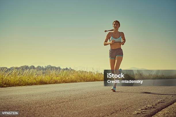Sporty Woman Running Stock Photo - Download Image Now - Women, Running, One Woman Only