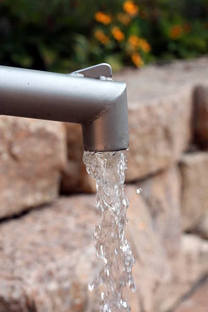 istock Water running from outdoor faucet 491657910