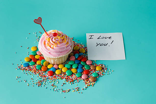 istock One cupcake on aquamarine background 491658660