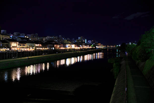 The Kamogawa River in Kyoto, Japan is popular walking spots for tourists. In summer, restaurants open balconies looking out to the river.
