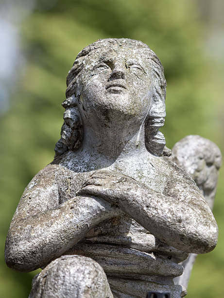 istock statue on grave in the old cemetery 491663315