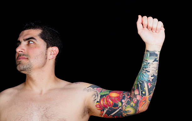 Homem Tattooed Braço - fotografia de stock