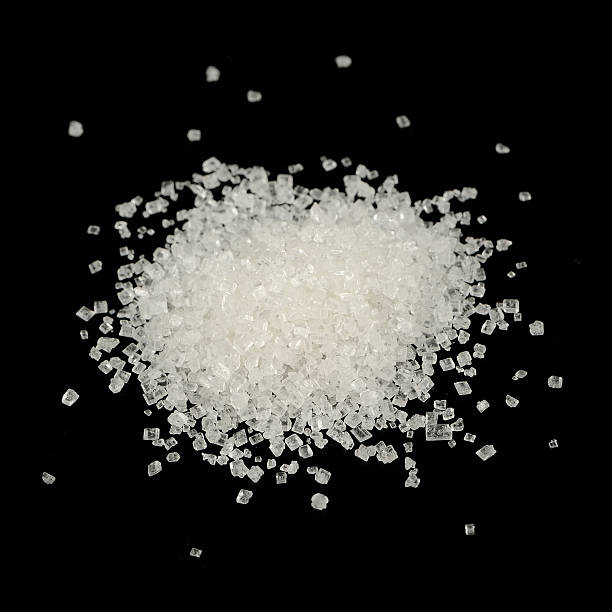 istock Pile of White Sugar on Black Background 491666551