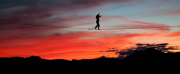 istock Highline walker in the sunset sky 491668033