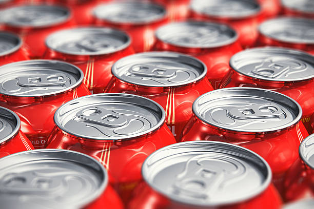 Macro view of drink cans Macro view of color drink tin cans with cola soda beverage with selective focus effect drink can photos stock pictures, royalty-free photos & images