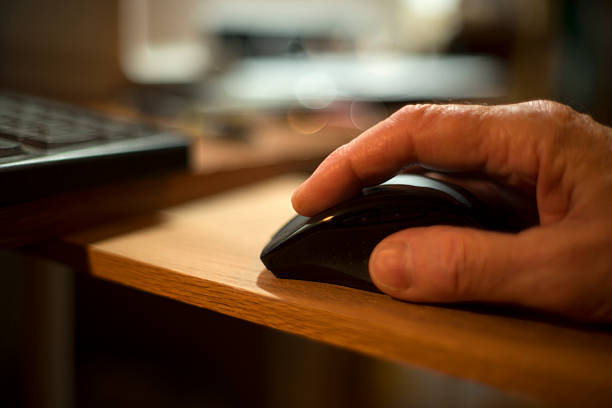 istock Closeup of Human Hand Operating Mouse 491668990