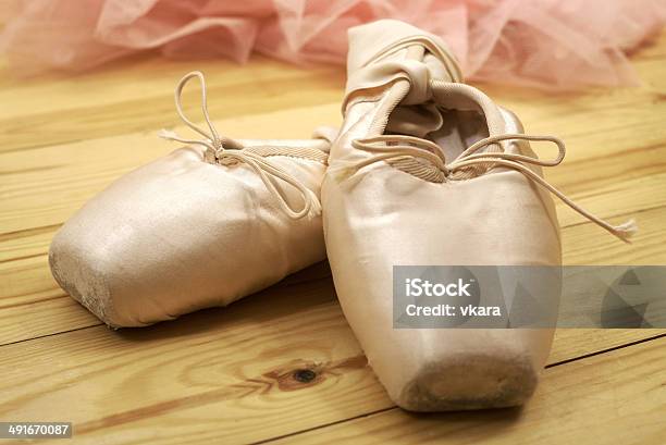 Pair Of Ballet Shoes Pointes On Wooden Floor Stock Photo - Download Image Now - Backgrounds, Ballet, Ballet Dancer
