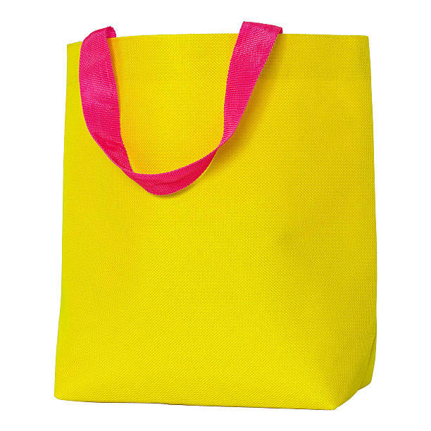 istock yellow shopping fabric bag isolated on white 491673398