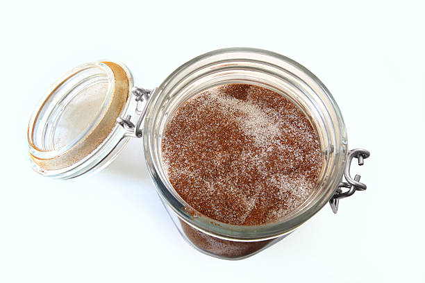 istock Open lidded jar.  Cinnamon and sugar.  Isolated on white. 491675092