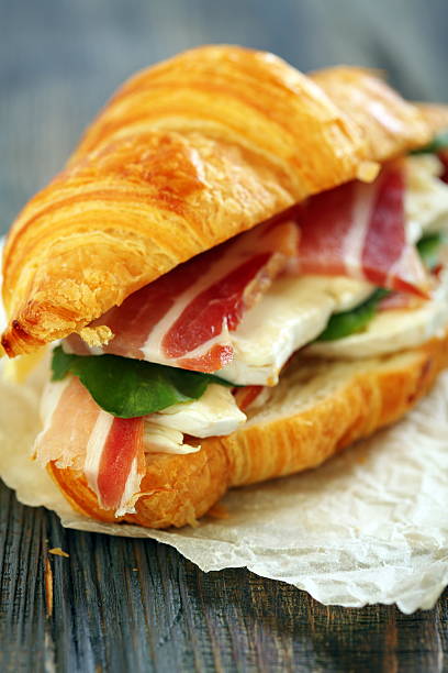 istock Sandwich with ham and cheese close up. 491679837