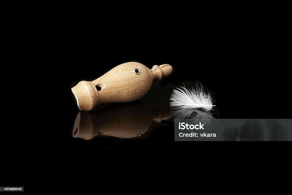 successful hunt wooden whistles for calling ducks with a feather Animal Stock Photo