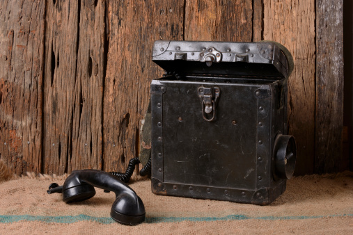 Old military field phone isolated
