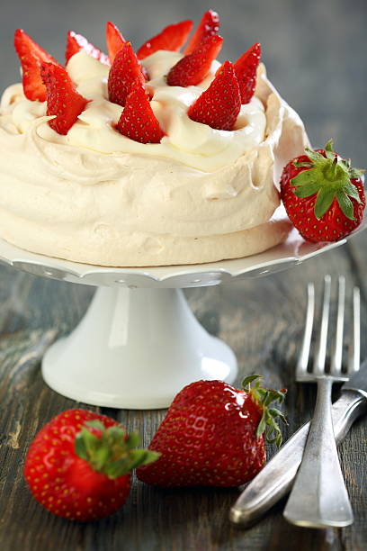 istock Meringue with whipped cream and strawberries. 491680497
