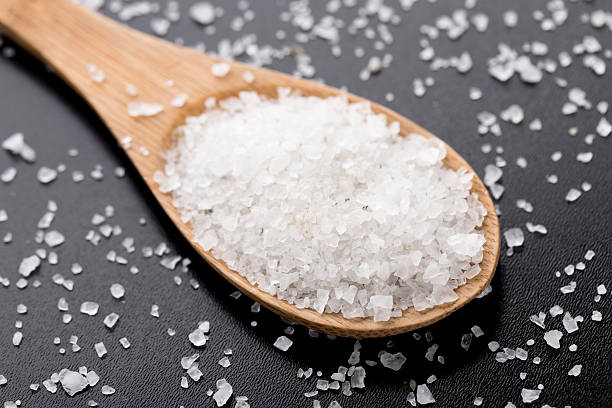 istock Sea salt in wooden spoon 491680559