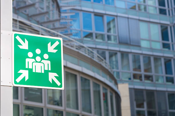 Assembly Area sign in front of business building stock photo