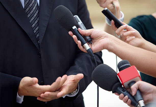 istock business meeting conference journalism microphones 491681445