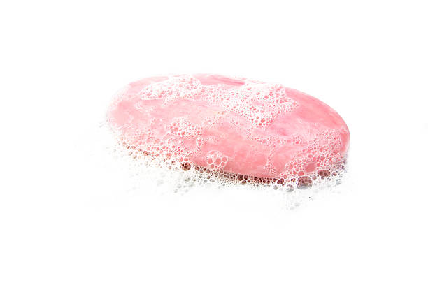 istock pink bar of soap with foam isolated on white 491681454