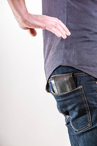 istock Closeup. Thief stealing wallet from back pocket of man. Theft. 491681683