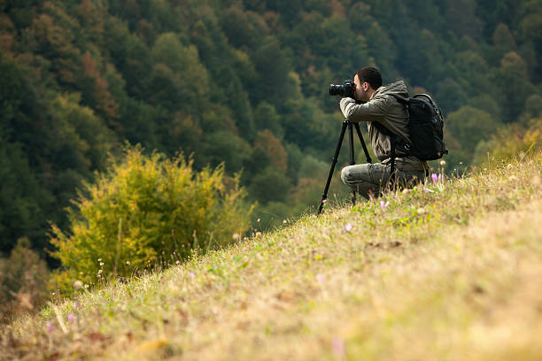 istock Landscape photographer in action 491681687