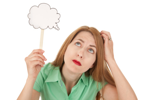 Upset thoughtful woman looking aside, posing on pink studio background. Unhappy young lady imagining something, feeling doubtful or upset