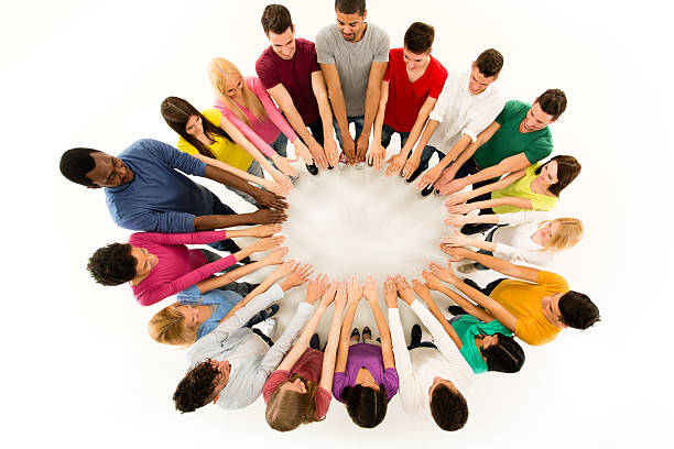 istock Large group of people forming a circle with hands 491683131