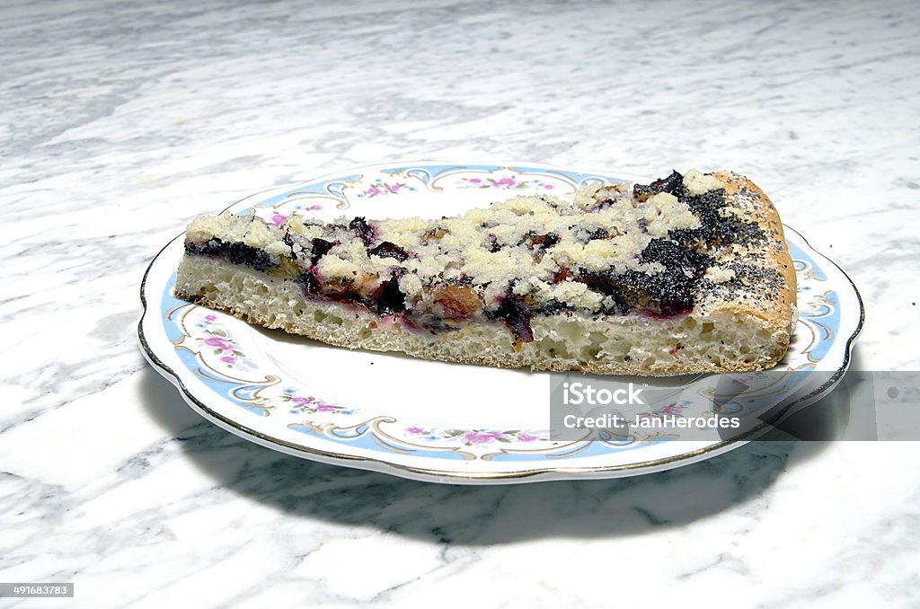 Plum cake Homemade plum cake sprinkled with sugar on a marble table Afternoon Tea Stock Photo