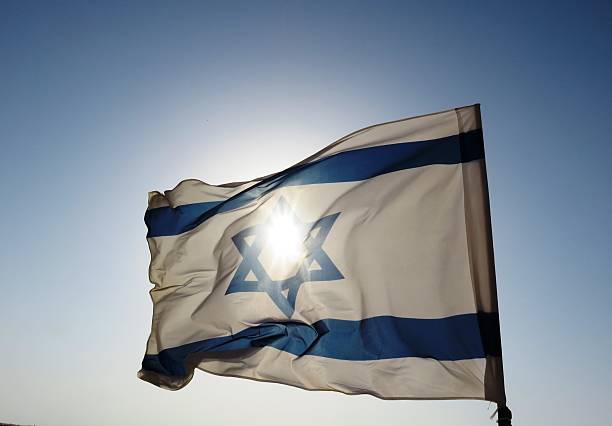 istock Israeli flag in strong wind 491684848
