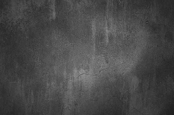 灰色のコンクリートの壁の背景に黒色 - stucco wall textured textured effect ストックフォトと画像