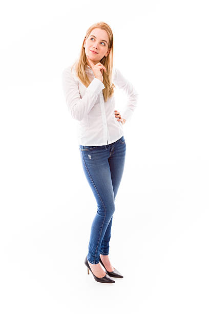 istock Young woman standing and thinking 491685179