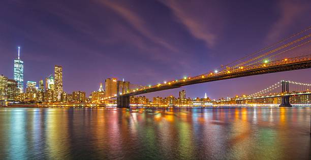 istock Brooklyn Bridge and downtown Manhattan skyline at nigh 491685840