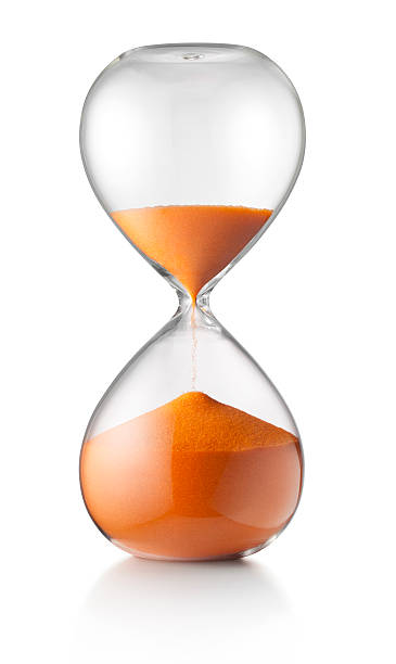 Hourglass Hourglass. Photo with clipping path. half past stock pictures, royalty-free photos & images