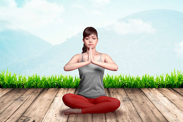 istock Asian woman doing yoga 491687498