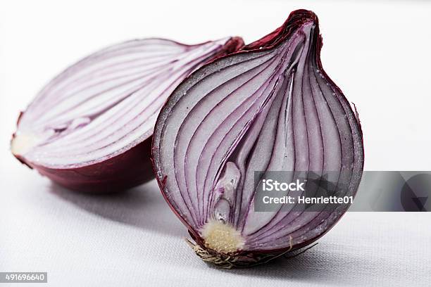 Two Halves Of A Red Onion On White Stock Photo - Download Image Now - 2015, Close-up, Color Image