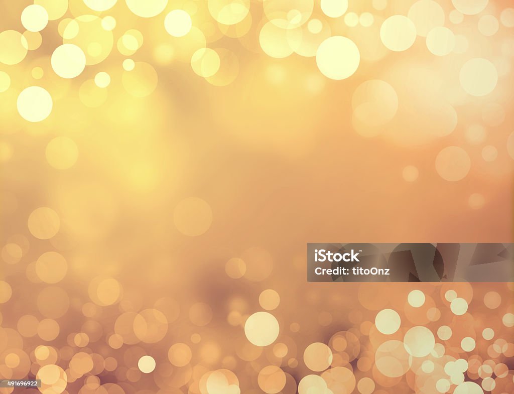 Festive sparkling lights Shiny gold background with blurry circles and sparkles Backgrounds Stock Photo