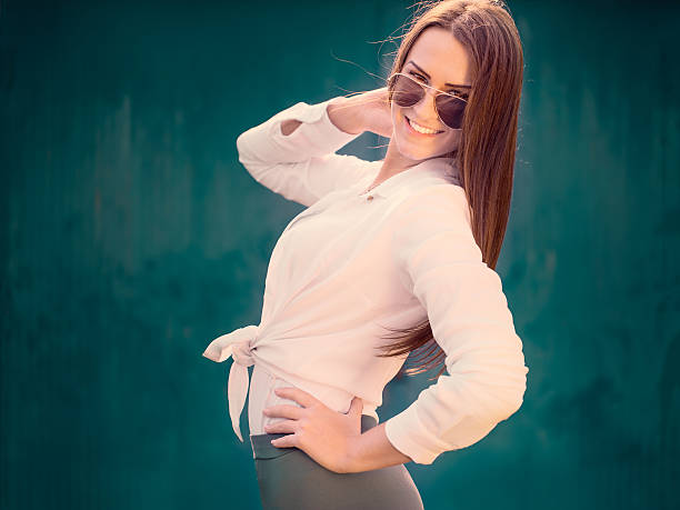 istock Young girl posing in front of blue background 491697252