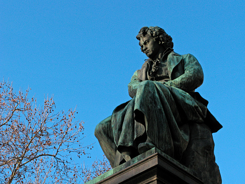 Sculpture of Ludwig van Beethoven on background clear blue sky. Austria, Vienna.