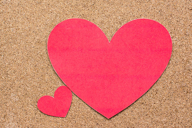 istock Two red heart-shaped paper on wood background 491699162