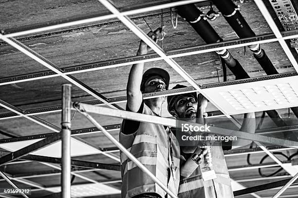 Suspended Ceiling Installation Stock Photo - Download Image Now - Ceiling, Hanging, Black And White