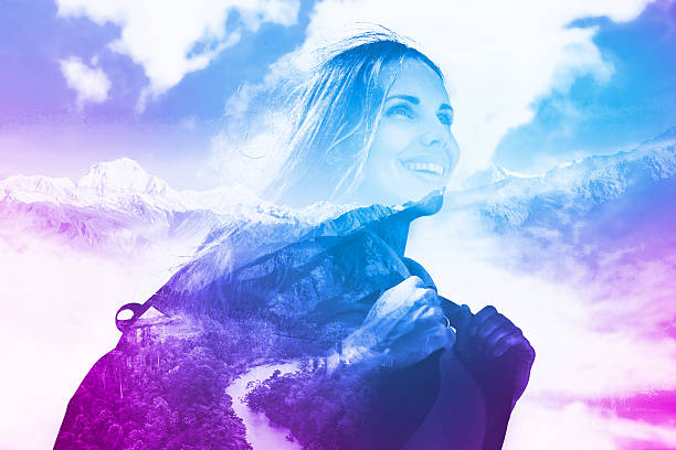 multi exposure effect of half transparent woman's portrait overlaying the mountain landscape