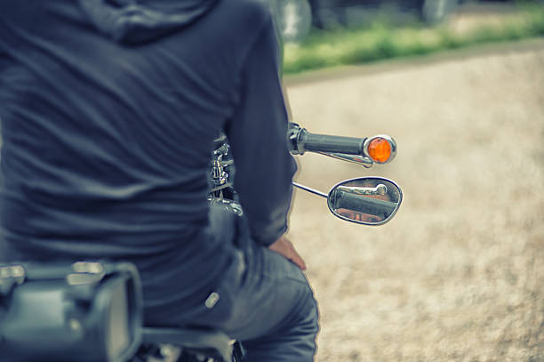 istock the Biker man sitting on his motorcycle, vintage effect 491701056