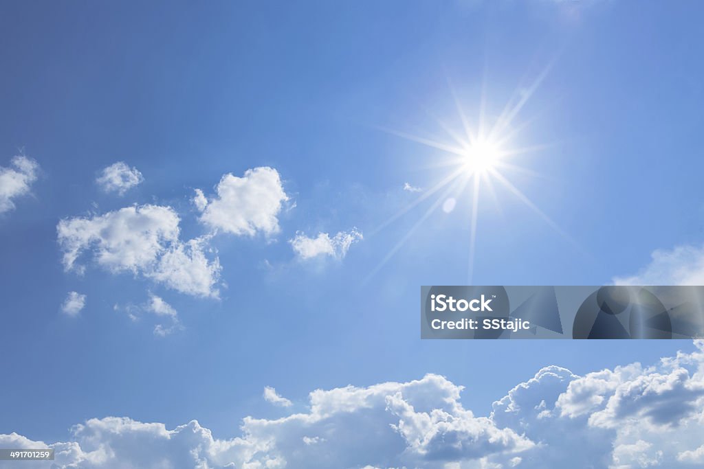 Blue sky with sun Blue sky with clouds and sun ray Sky Stock Photo