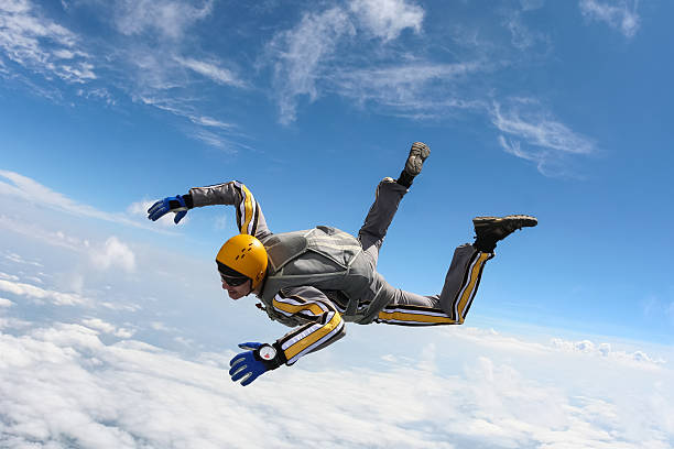 Skydiving photo. The student performs the task skydiver in freefall. skydiving stock pictures, royalty-free photos & images