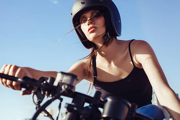 istock Biker girl sitting on vintage custom motorcycle 491702658
