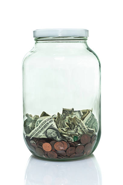 istock Glass jar with lid and some money in the bottom 491703337