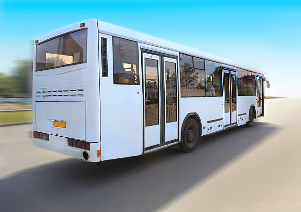 istock white bus goes on the road 491703433