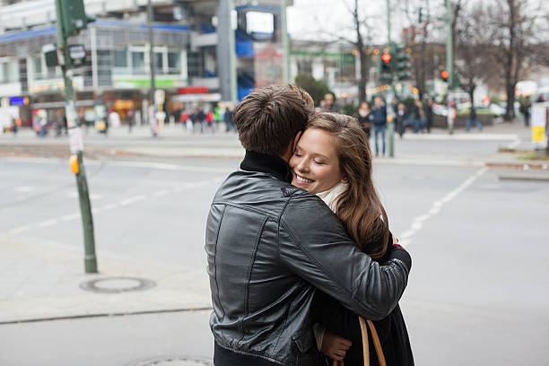 istock Couple In Jackets Embracing On Street Side 491704017