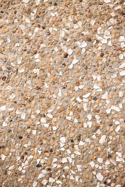 istock Small stones gravel wall texture. 491704381