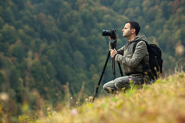 istock Landscape photographer in action 491704799